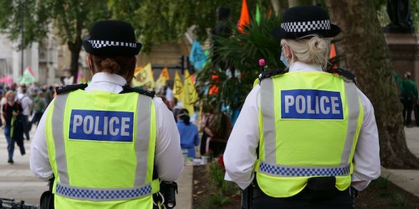 Two police officers in face masks