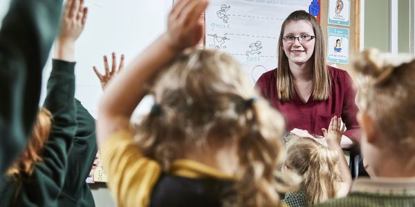 Teacher with a class of young children